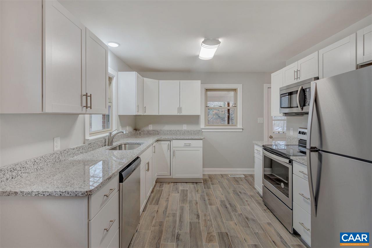 520 Stephens Loop Ruckersville, VA 22968 - Photo 8 of 33 a kitchen with a refrigerator sink and stove top oven