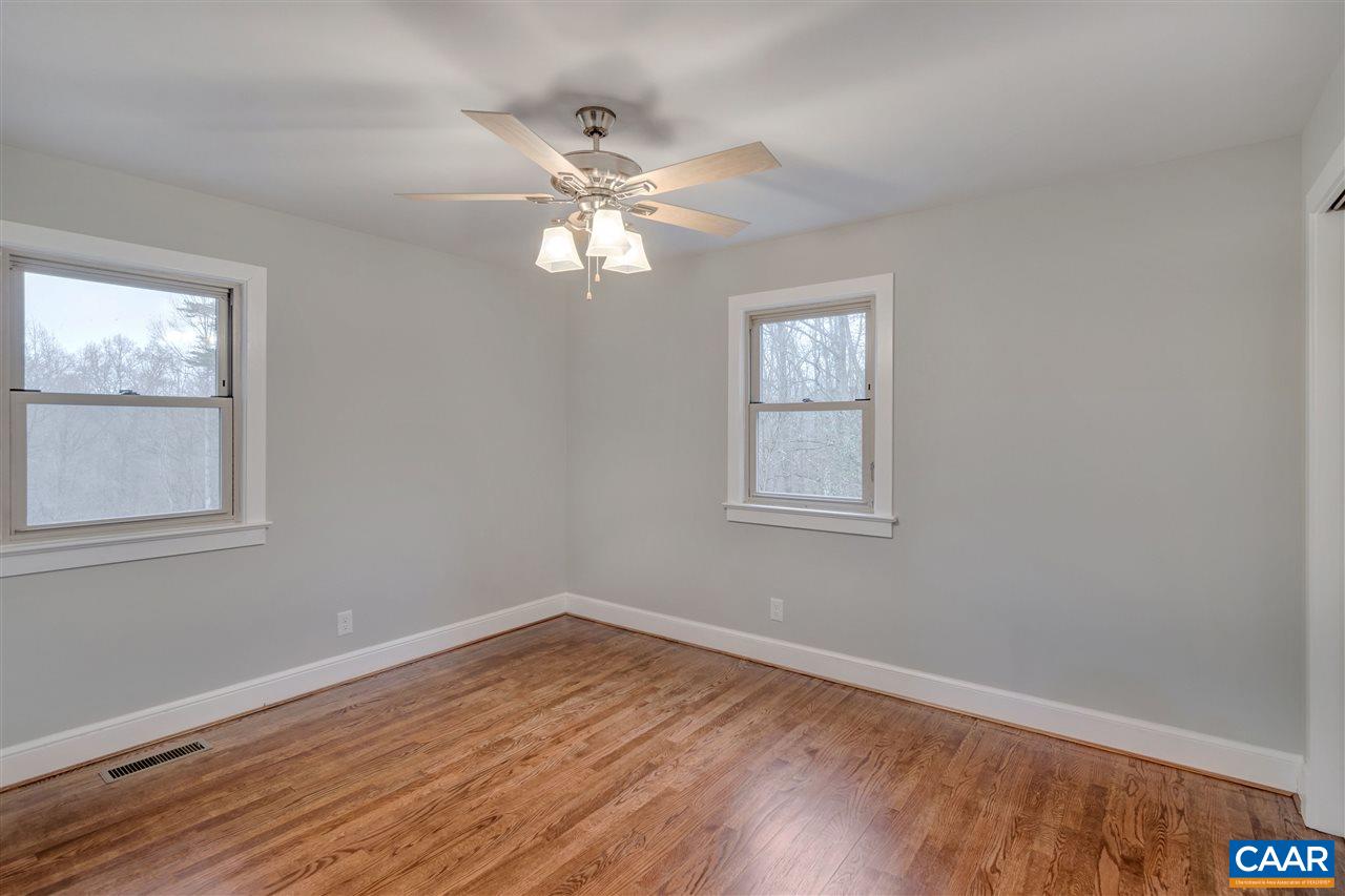 520 Stephens Loop Ruckersville, VA 22968 - Photo 10 of 33 a view of empty room with wooden floor and fan