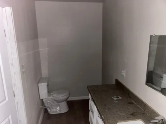 a bathroom with a toilet and a sink