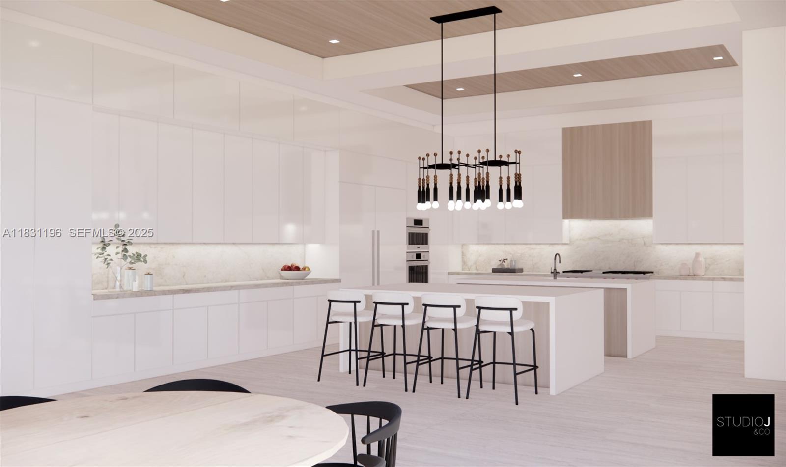 17025 Stratford Court Southwest Ranches, FL 33331 - Photo 11 of 17 a kitchen with a sink a stove a dining table and chairs