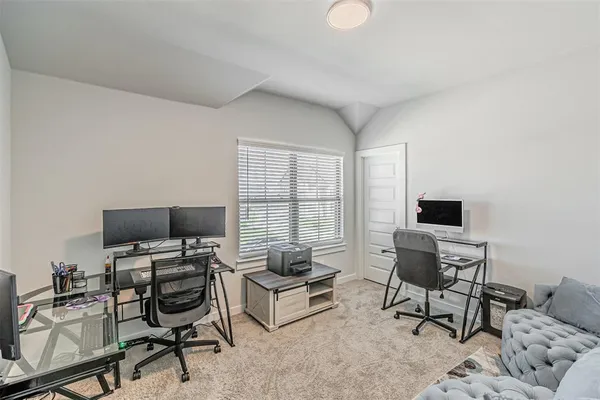 a workspace with a couch and a window