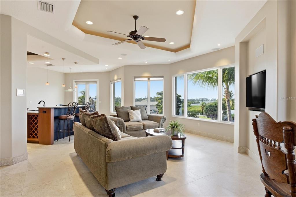 761 Norton Street Longboat Key, FL 34228 - Photo 33 of 66 a living room with furniture and a flat screen tv