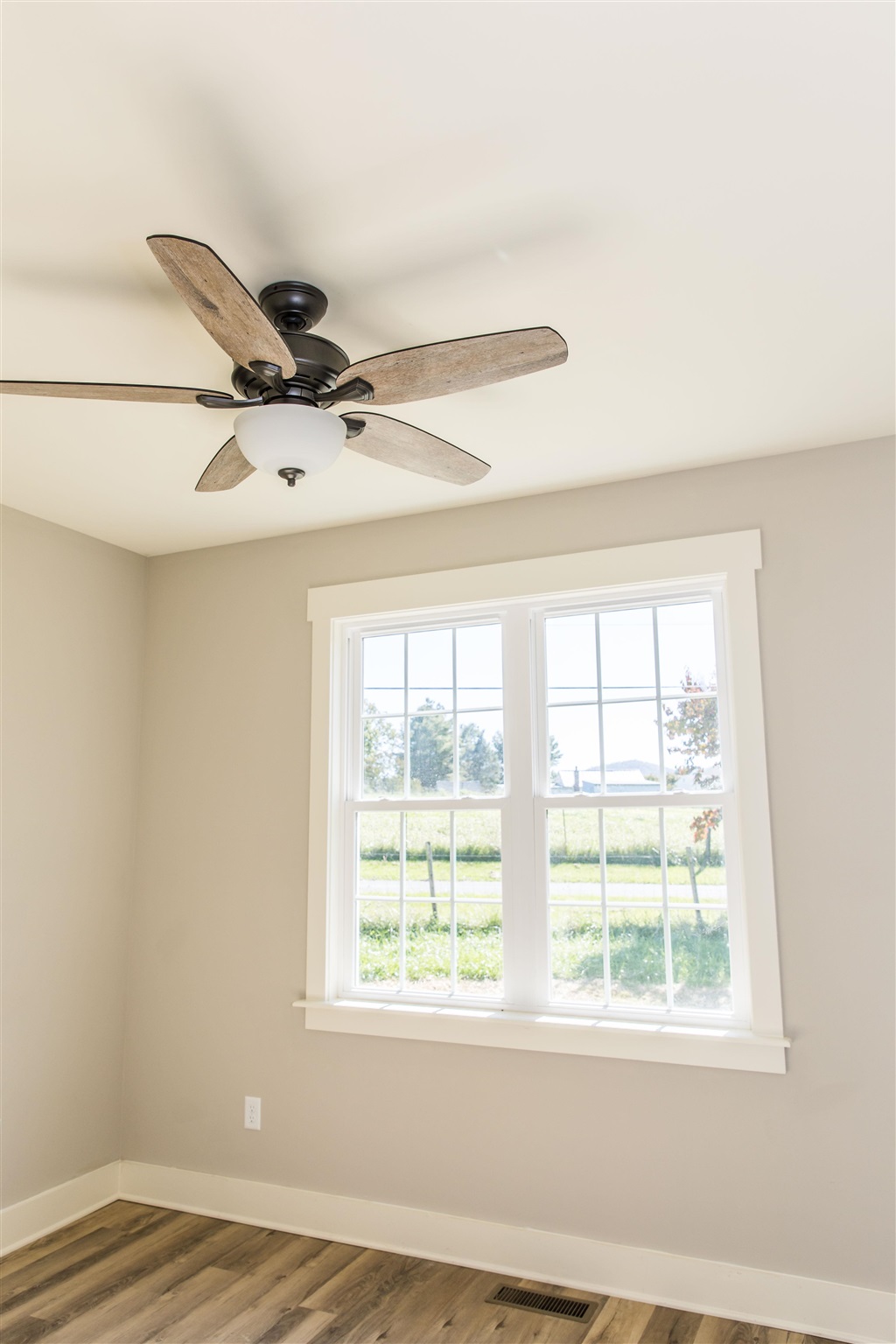 117 Spottswood Road Raphine, VA 24472 - Photo 23 of 52 a view of a livingroom with a window and a ceiling fan