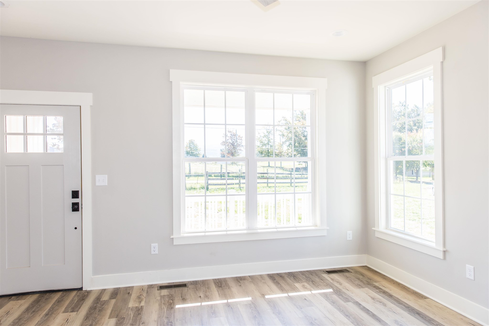 117 Spottswood Road Raphine, VA 24472 - Photo 45 of 52 an empty room with wooden floor and windows