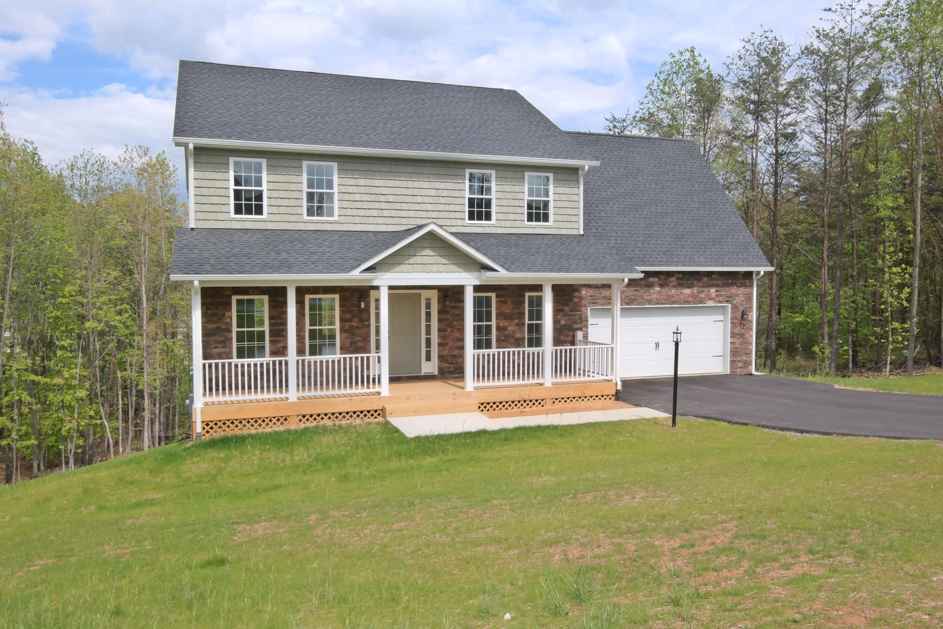 594 Thornblade Way Blue Ridge, VA 24064 - Photo 1 of 21 a view of a house with a yard and sitting area