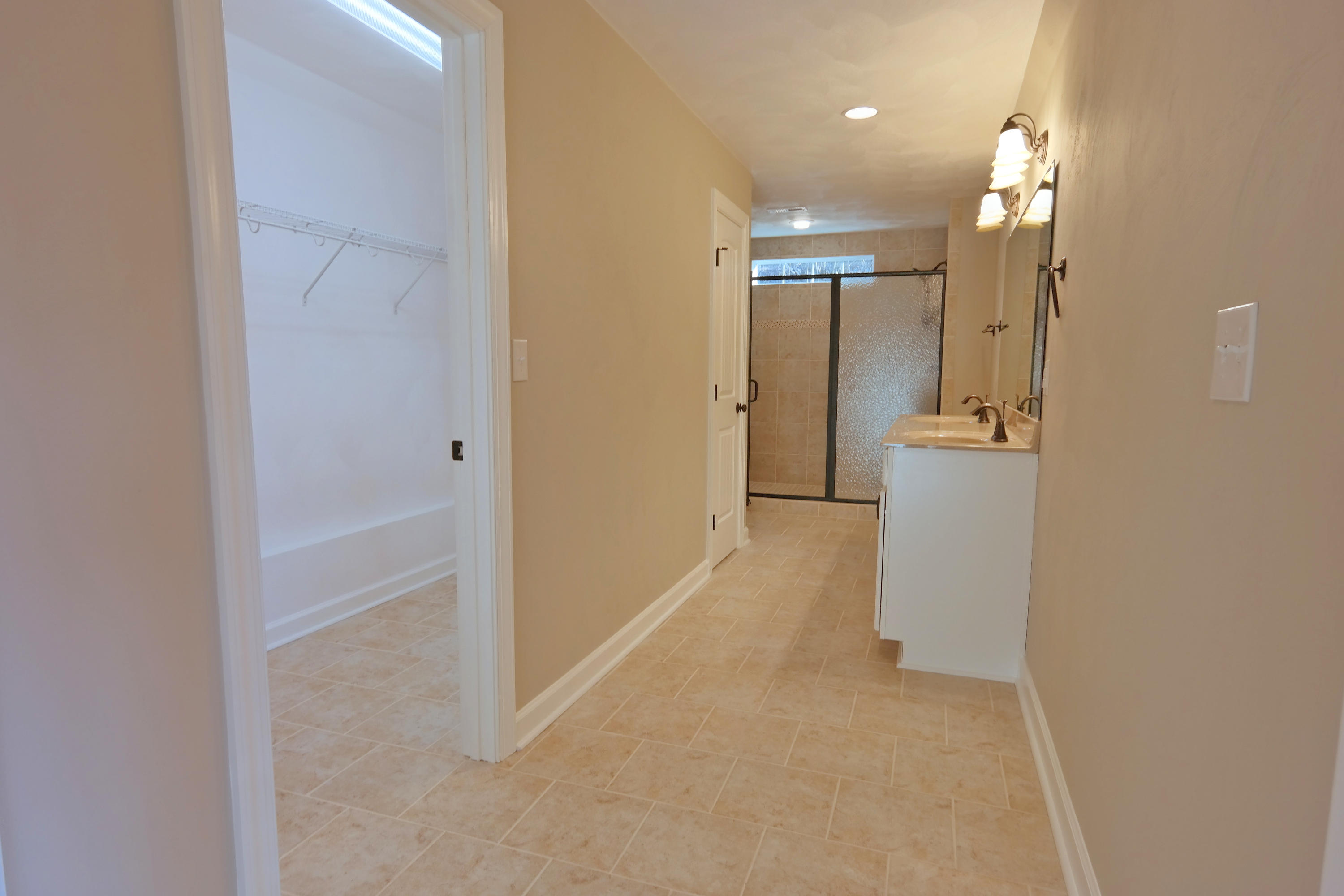 594 Thornblade Way Blue Ridge, VA 24064 - Photo 12 of 21 a view of a hallway with wooden floor and a bathroom