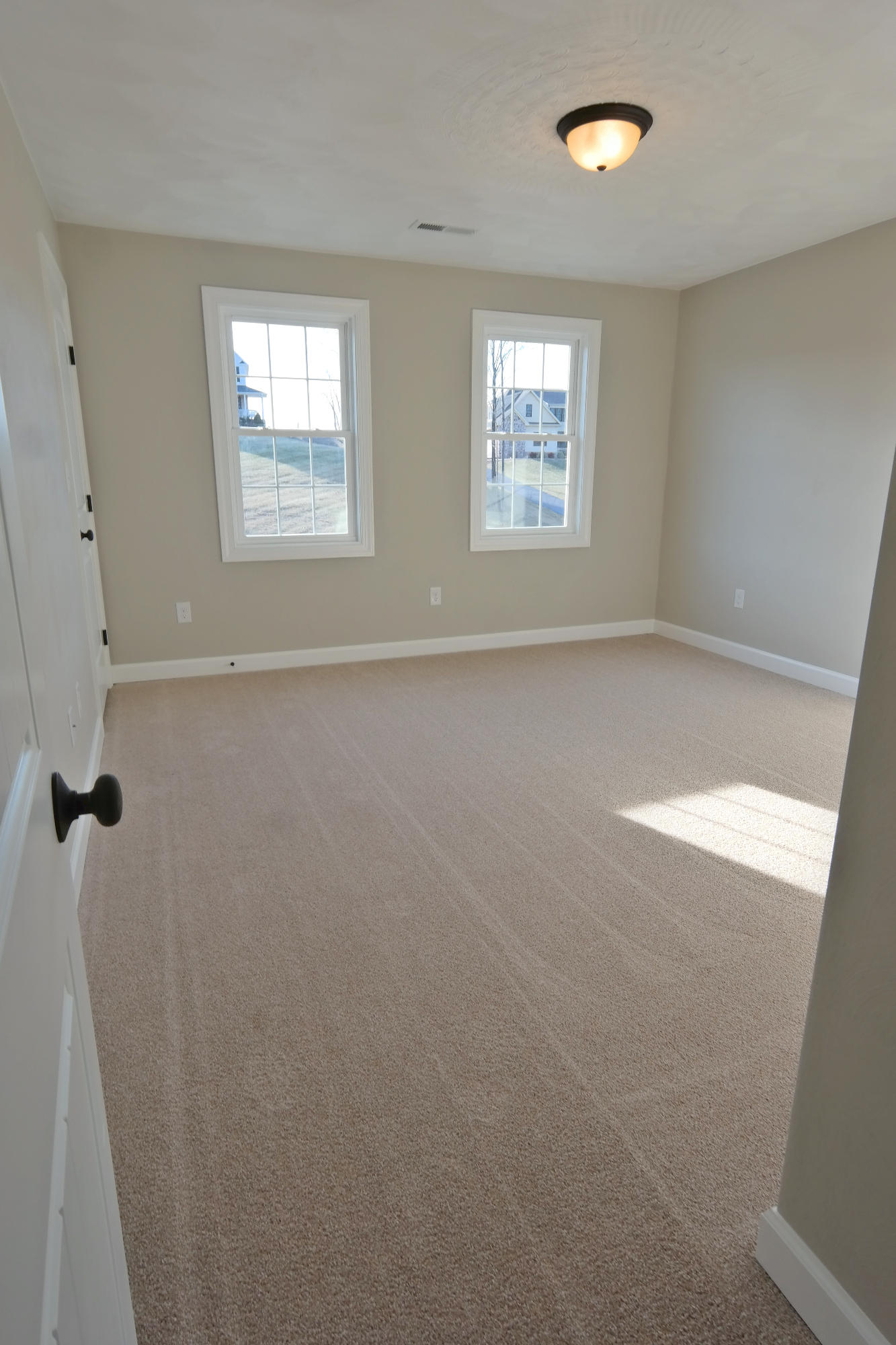 594 Thornblade Way Blue Ridge, VA 24064 - Photo 17 of 21 a view of an empty room with windows