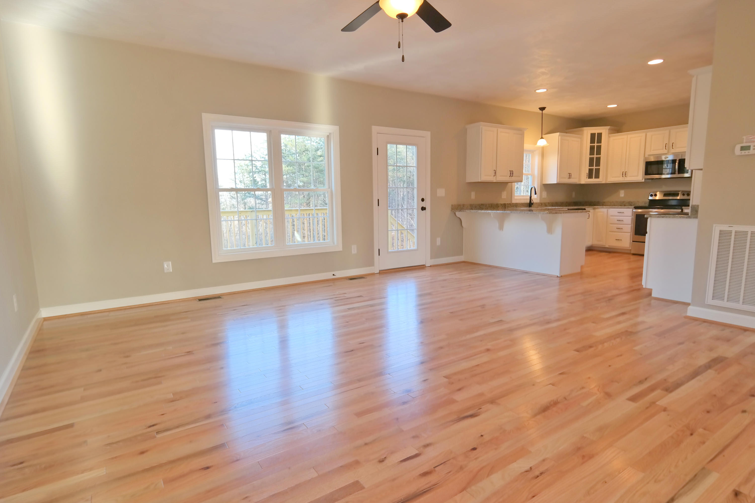 594 Thornblade Way Blue Ridge, VA 24064 - Photo 7 of 21 a view of kitchen with wooden floor and a window