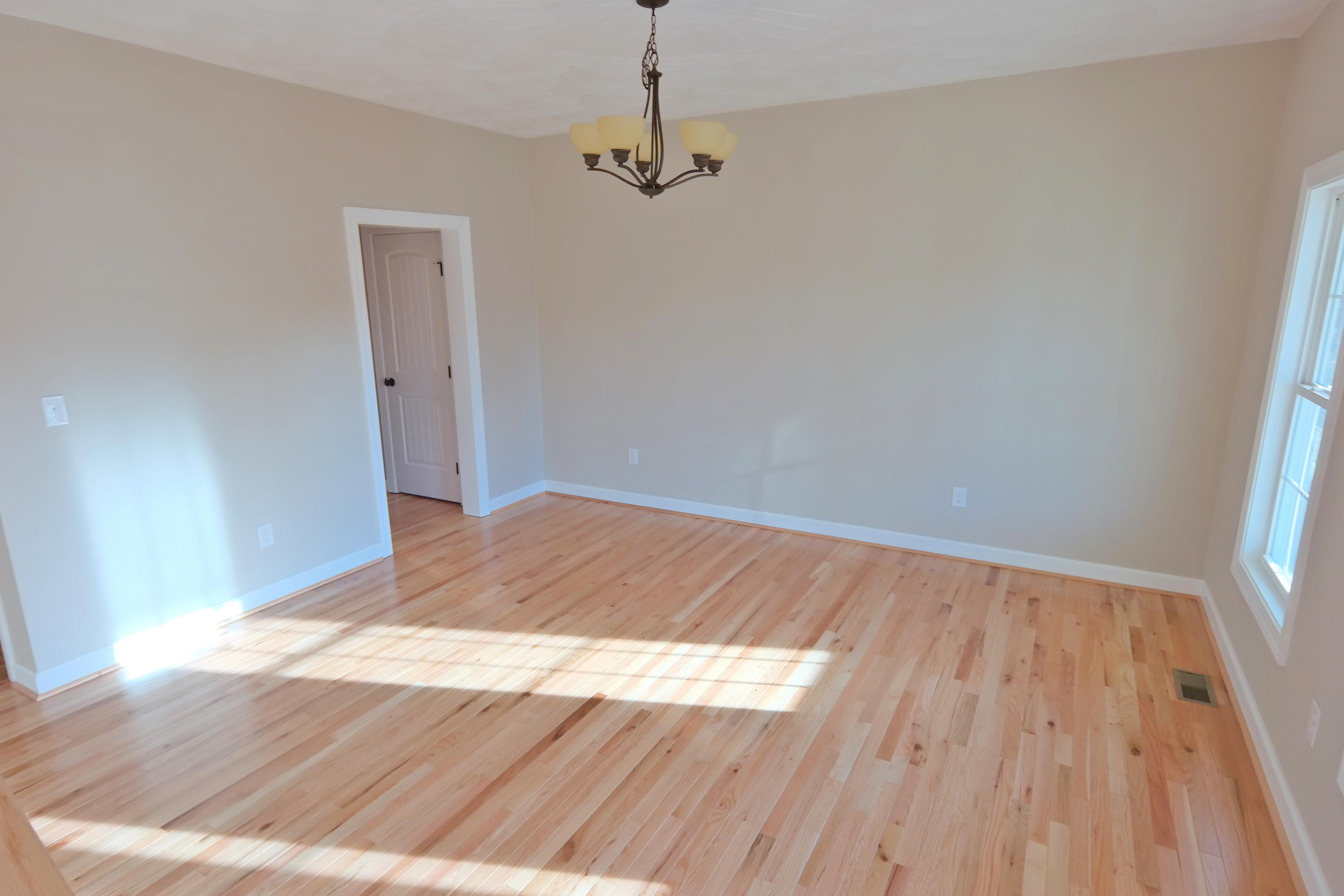 594 Thornblade Way Blue Ridge, VA 24064 - Photo 9 of 21 a view of empty room with wooden floor