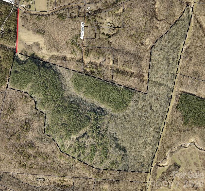 a aerial view of a house with a yard