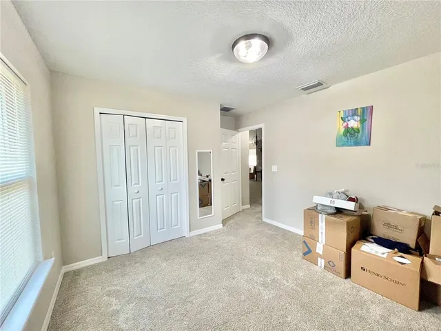 a view of a livingroom with furniture and a window