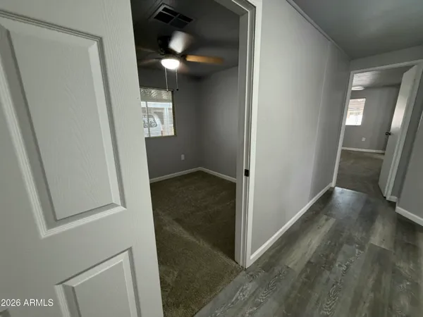 a bathroom with a sink a mirror and vanity