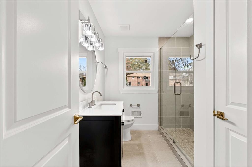 3292 Toney Drive Decatur, GA 30032 - Photo 13 of 28 a bathroom with a sink and a mirror