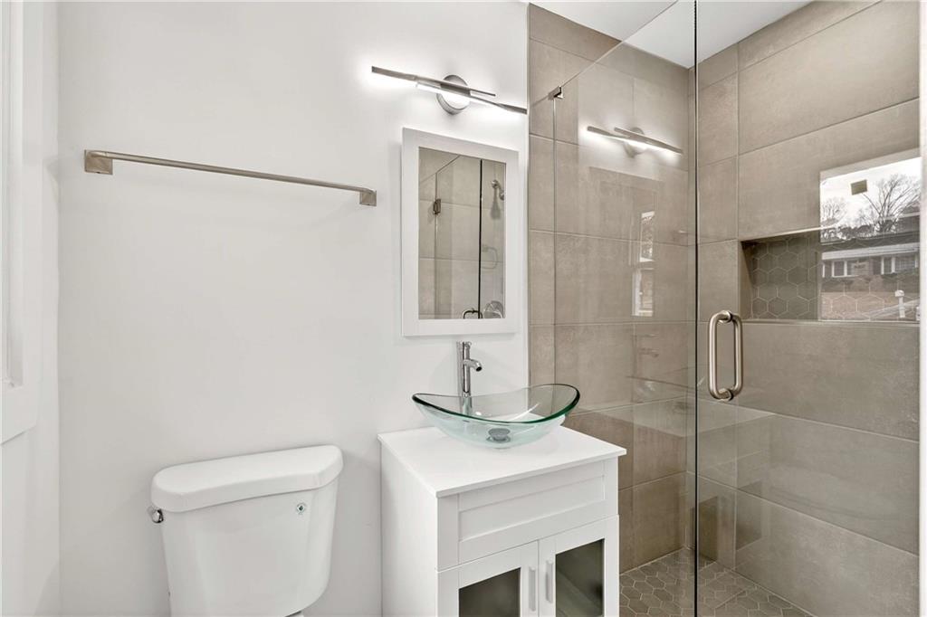 3292 Toney Drive Decatur, GA 30032 - Photo 17 of 28 a bathroom with a sink a toilet and shower