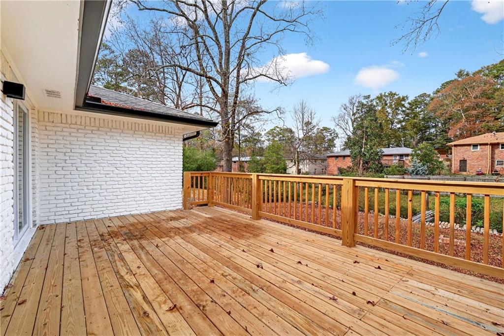 3292 Toney Drive Decatur, GA 30032 - Photo 21 of 28 a view of a house with a wooden bridge