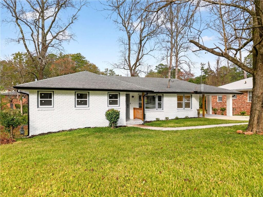 3292 Toney Drive Decatur, GA 30032 - Photo 3 of 28 a front view of a house with a garden