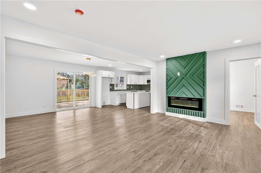 3292 Toney Drive Decatur, GA 30032 - Photo 8 of 28 a view of empty room with wooden floor and window