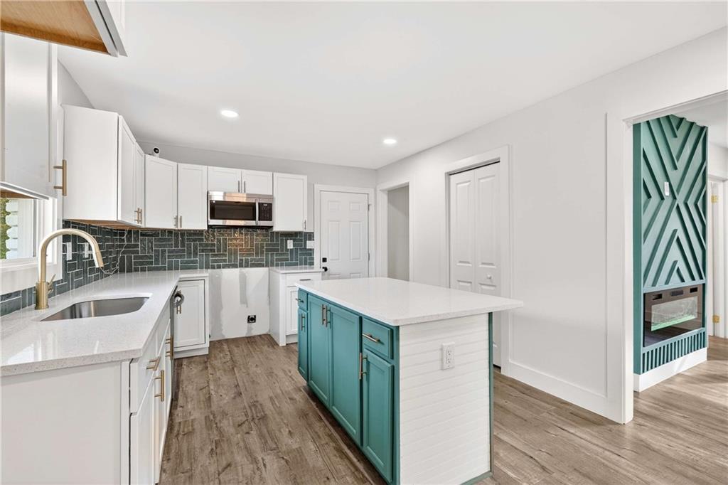 3292 Toney Drive Decatur, GA 30032 - Photo 10 of 28 a kitchen with white cabinets sink and stove