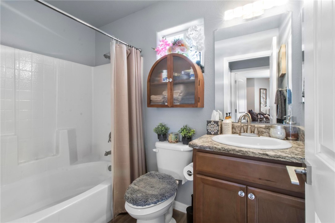 3897 Easy Street Kingman, AZ 86409 - Photo 30 of 53 a bathroom with a sink vanity mirror toilet and bathtub
