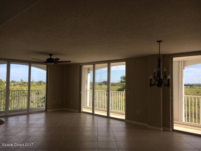 811 Del Rio Way, Unit 402 Merritt Island, FL 32953 - Photo 8 of 14 GREAT ROOM BLINDS OPEN TO SHOW VIEW