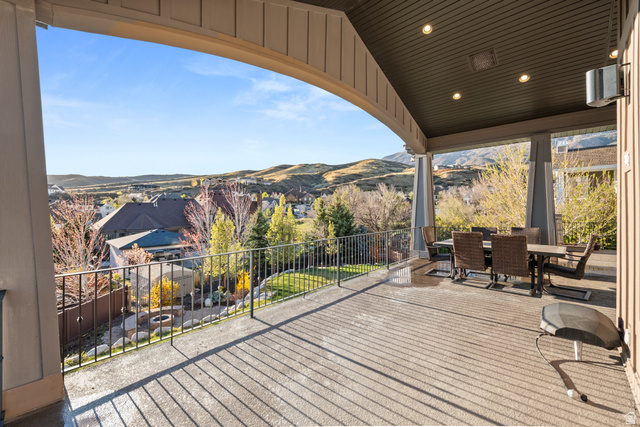 1205 North Elk Rdg Lane, Unit 202 Alpine, UT 84004 - Photo 68 of 88 Expansive covered patio featuring a concrete surface, recessed lighting, and an arched beam structure