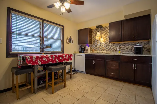 a spacious bedroom with a bed and window