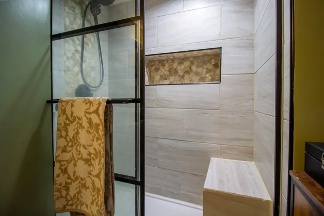 a view of a chairs and table in the backyard