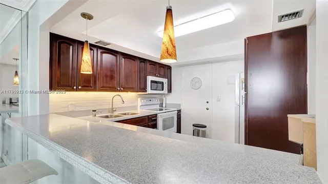 $266,000 | 427 Golden Isles Drive, Unit 5J, Hallandale Beach, FL 33009