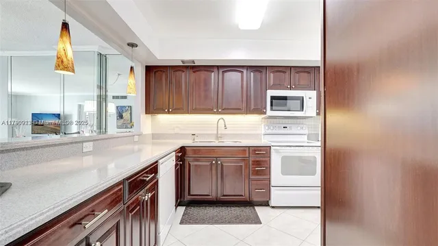 $266,000 | 427 Golden Isles Drive, Unit 5J, Hallandale Beach, FL 33009