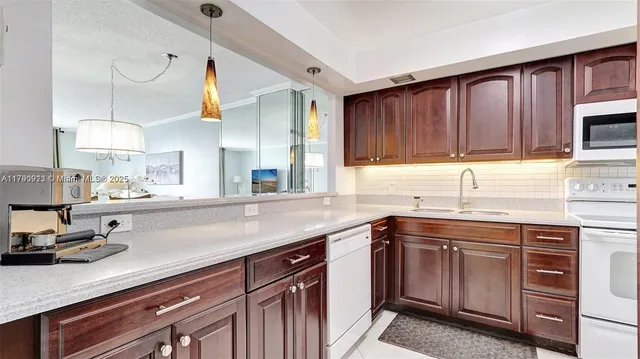 $266,000 | 427 Golden Isles Drive, Unit 5J, Hallandale Beach, FL 33009