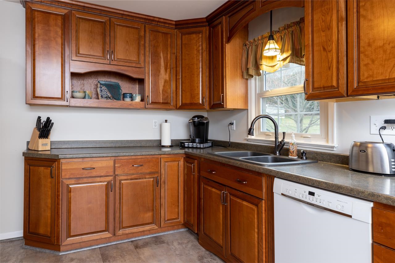 204 Robinhood Road Staunton, VA 24401 - Photo 10 of 46 a kitchen with stainless steel appliances granite countertop a sink dishwasher stove and cabinets