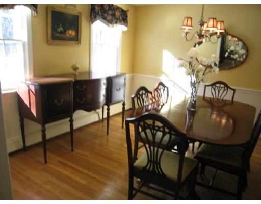 505 Hayward Mill Road Concord, MA 01742 - Photo 3 of 12 a view of a dining room with furniture and wooden floor