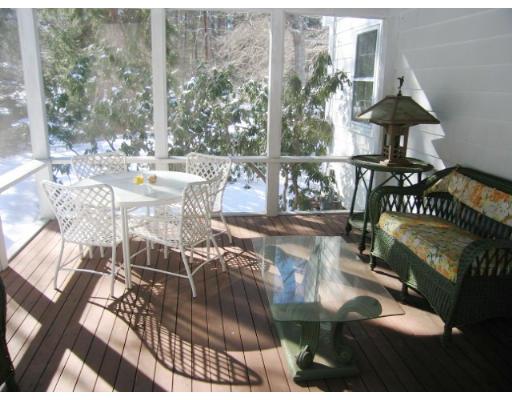 505 Hayward Mill Road Concord, MA 01742 - Photo 7 of 12 a view of a patio with table and chairs with wooden floor