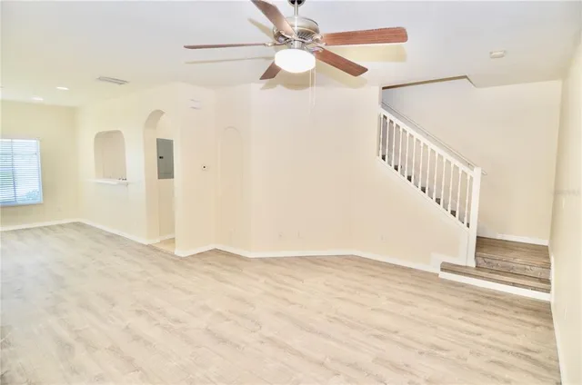 a view of an entryway with wooden floor