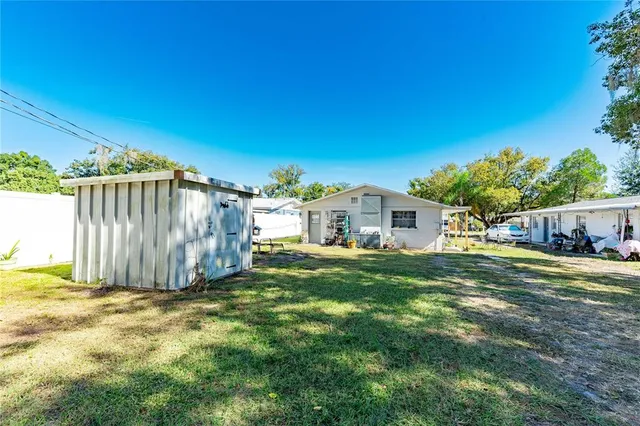 a view of a back yard of the house