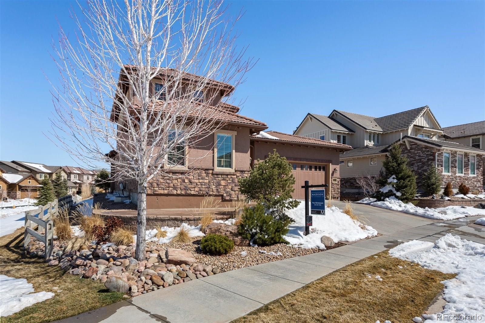 10634 Sundial Rim Road Highlands Ranch, CO 80126 - Photo 2 of 40 a front view of a house with a yard