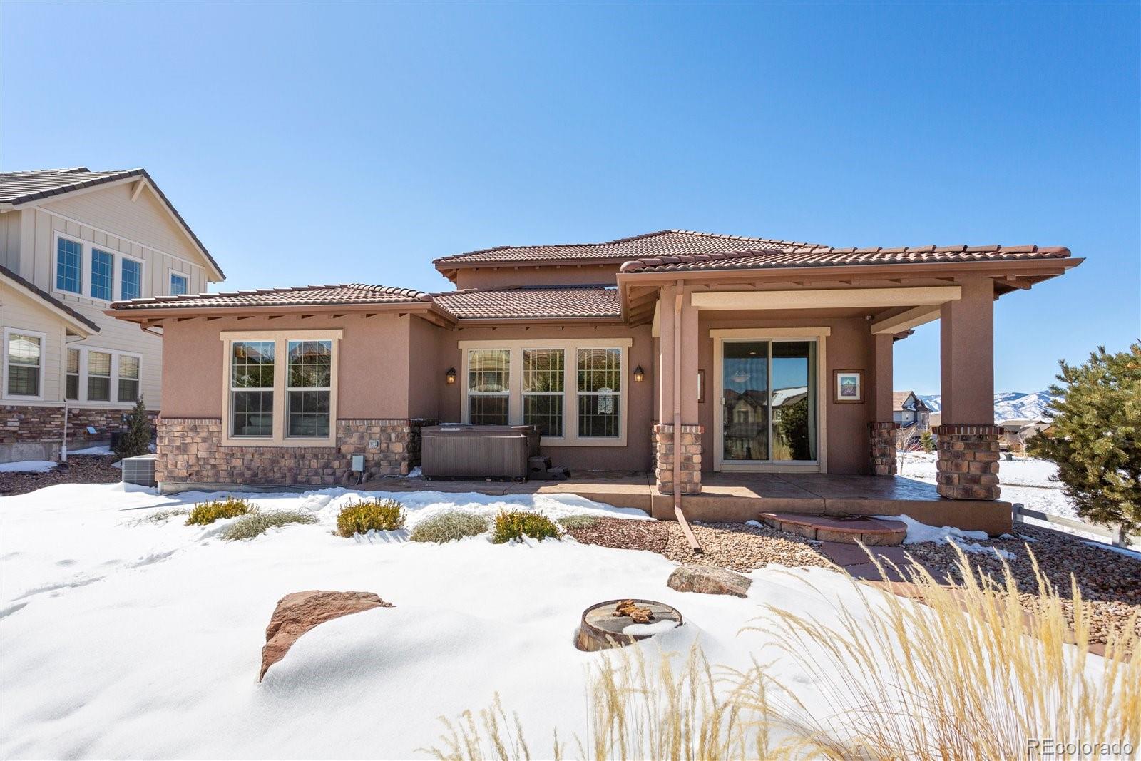 10634 Sundial Rim Road Highlands Ranch, CO 80126 - Photo 36 of 40 a view of a house with swimming pool and sitting area