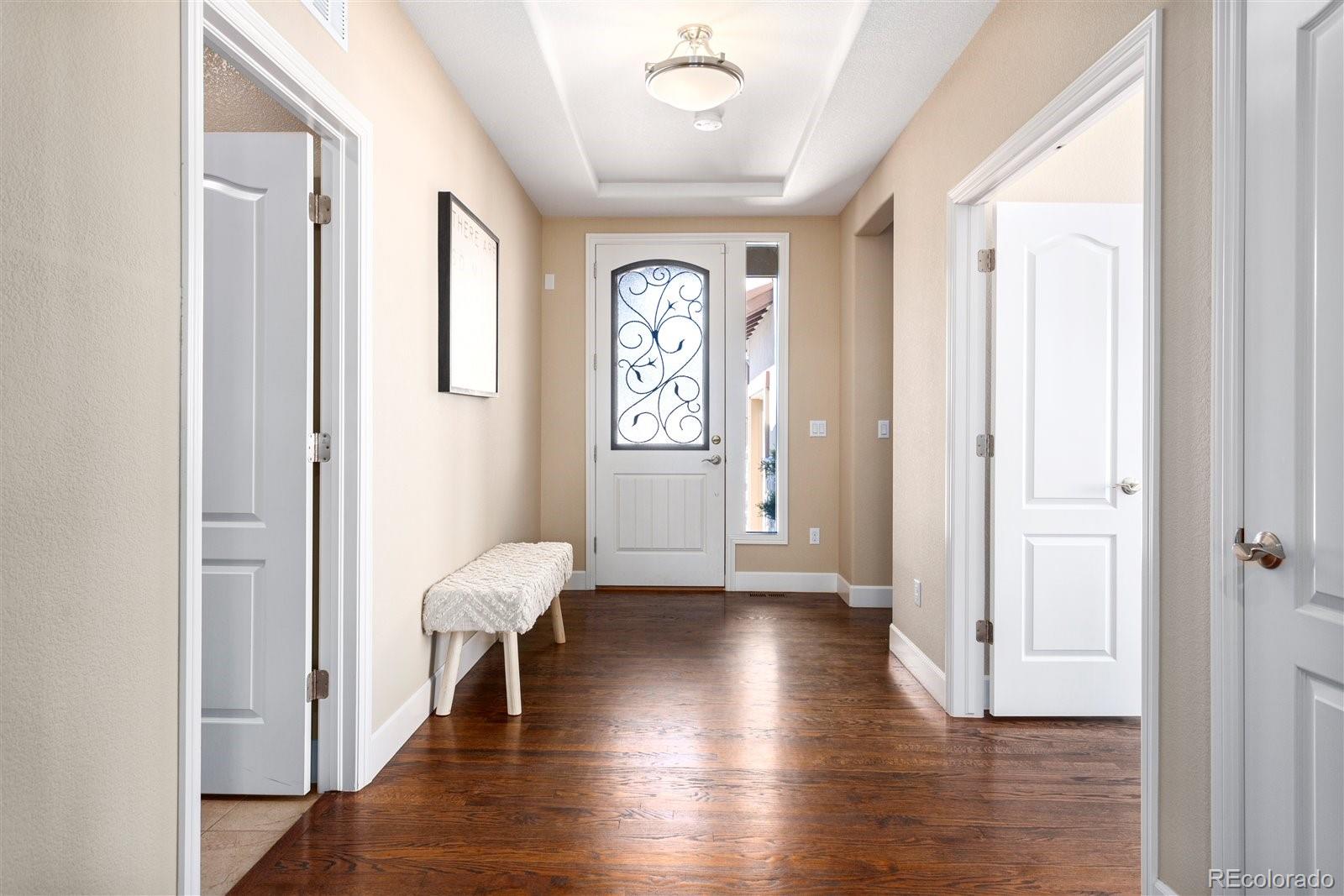 10634 Sundial Rim Road Highlands Ranch, CO 80126 - Photo 8 of 40 a view of entryway with wooden floor