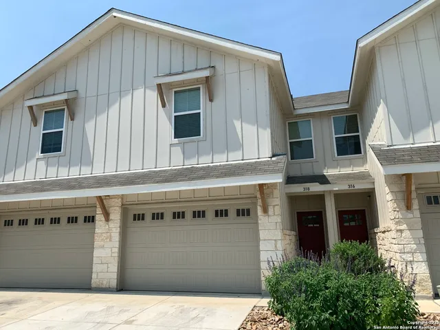 a front view of a house with a garage