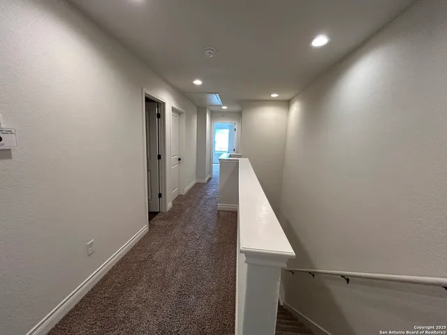 a view of hallway with stairs