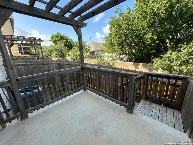 a view of balcony with wooden floor and stairs