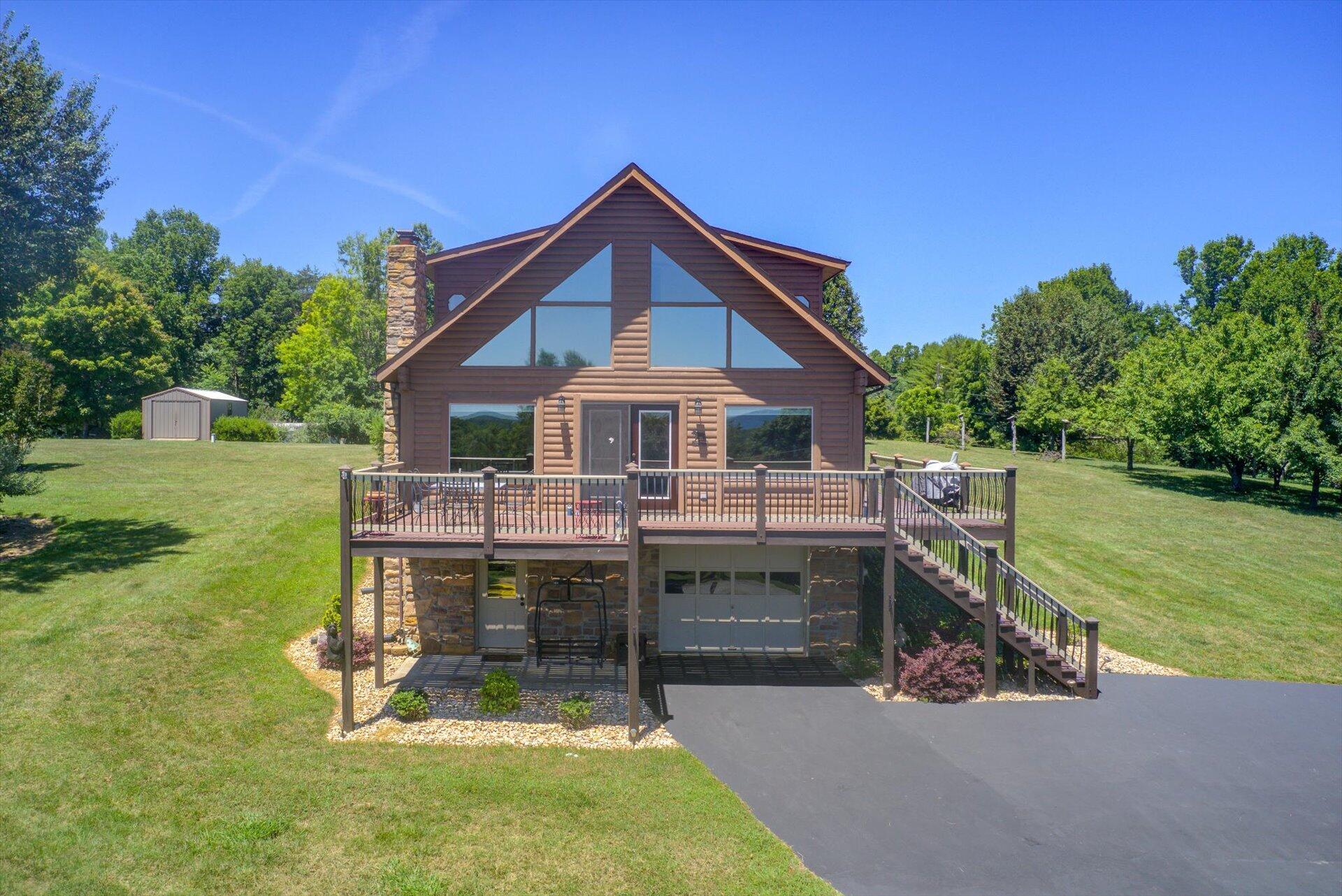 a view of a house with a yard porch and sitting area