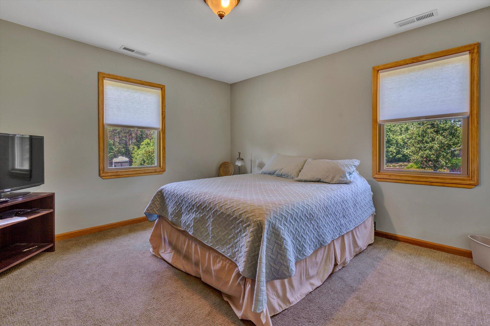 3499 Kemp Ford Road Union Hall, VA 24176 - Photo 22 of 52 a spacious bedroom with a bed and a window