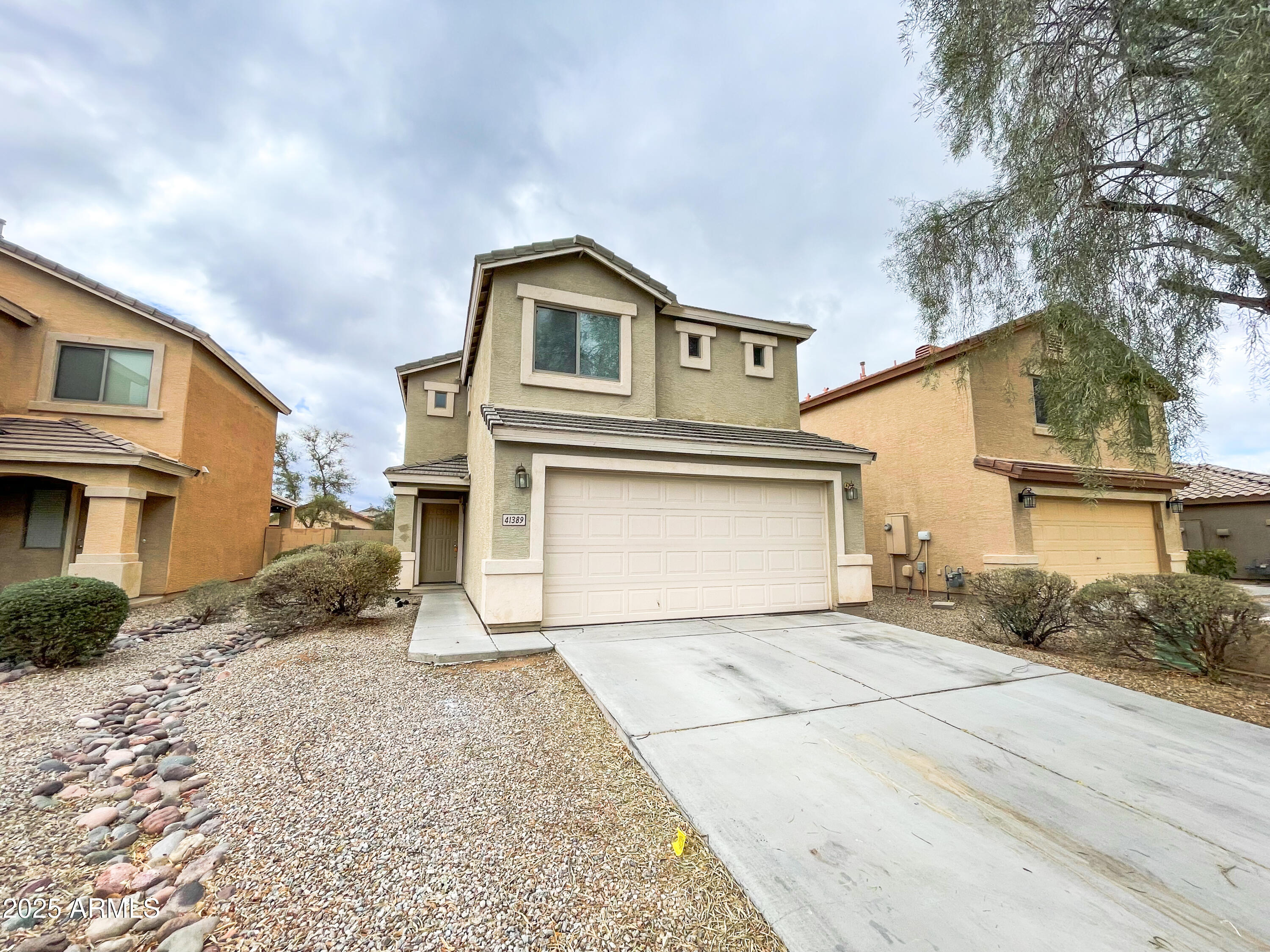 41389 Hopper Drive Maricopa, AZ 85138 - Photo 1 of 17 a front view of a house with a yard
