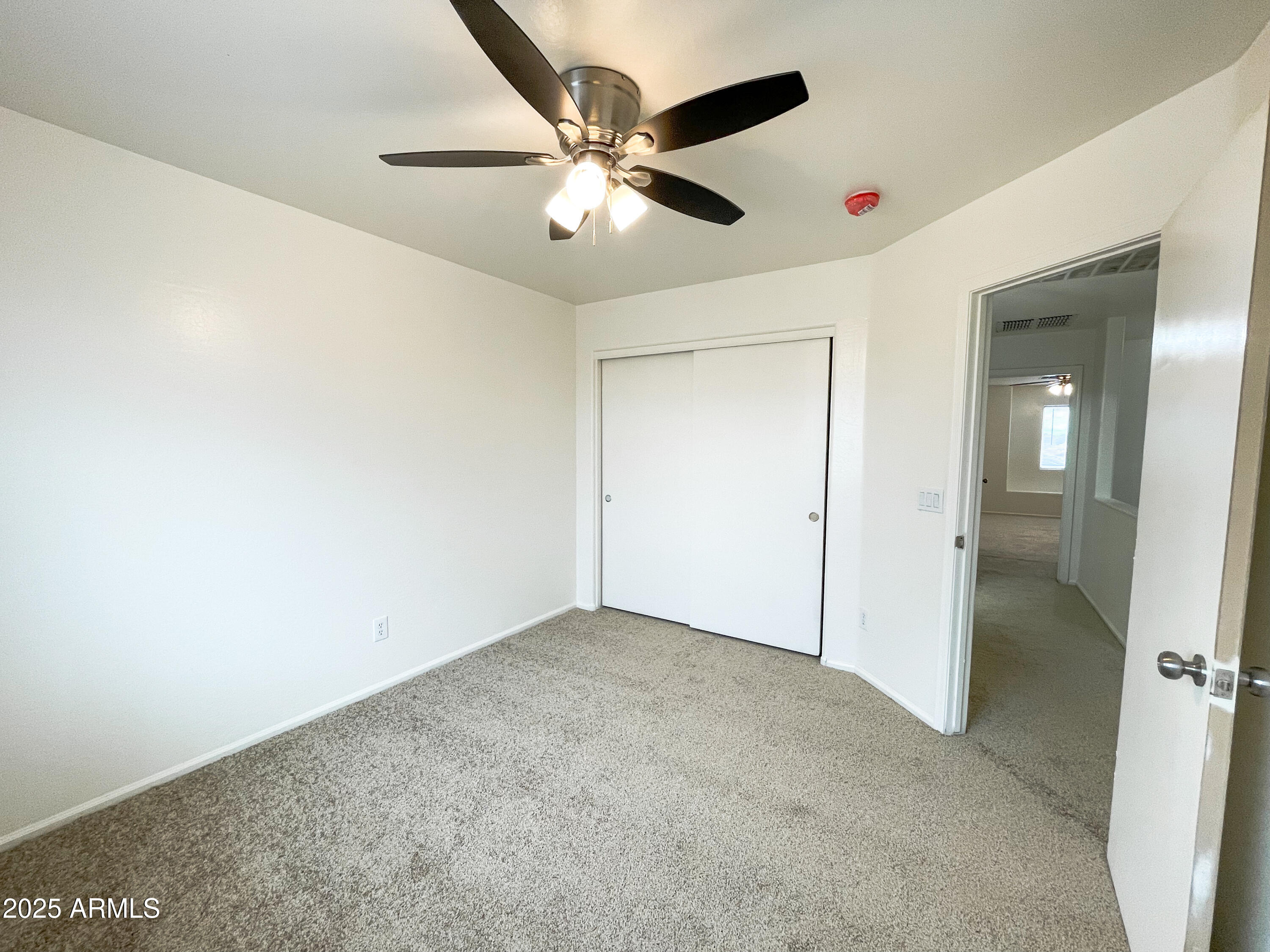 41389 Hopper Drive Maricopa, AZ 85138 - Photo 11 of 17 an empty room with closet and entryway