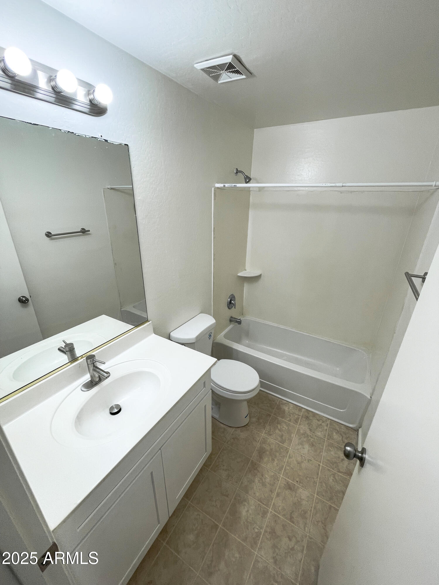 41389 Hopper Drive Maricopa, AZ 85138 - Photo 12 of 17 a bathroom with a sink a toilet and shower