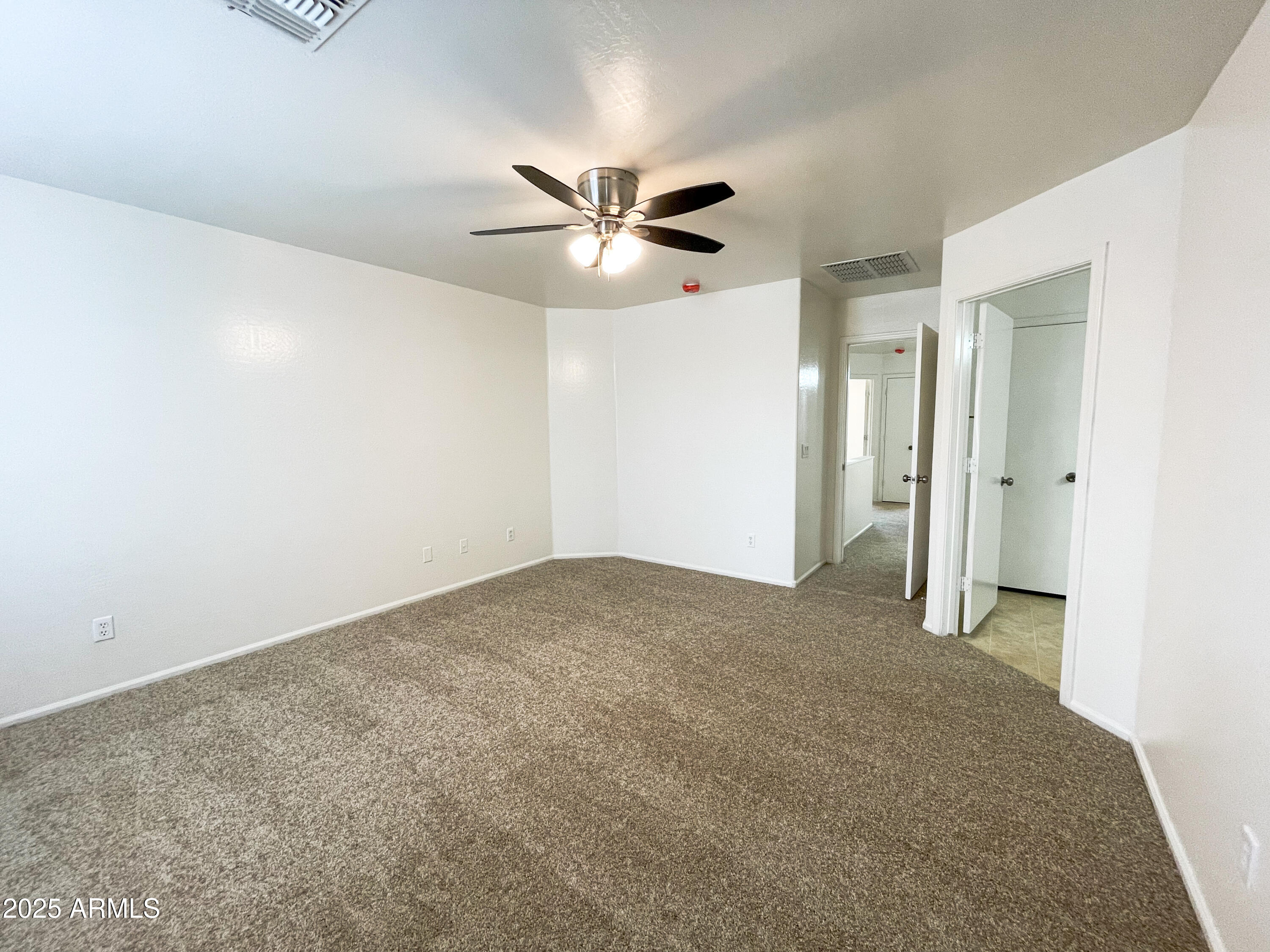 41389 Hopper Drive Maricopa, AZ 85138 - Photo 14 of 17 a view of a big room with carpet