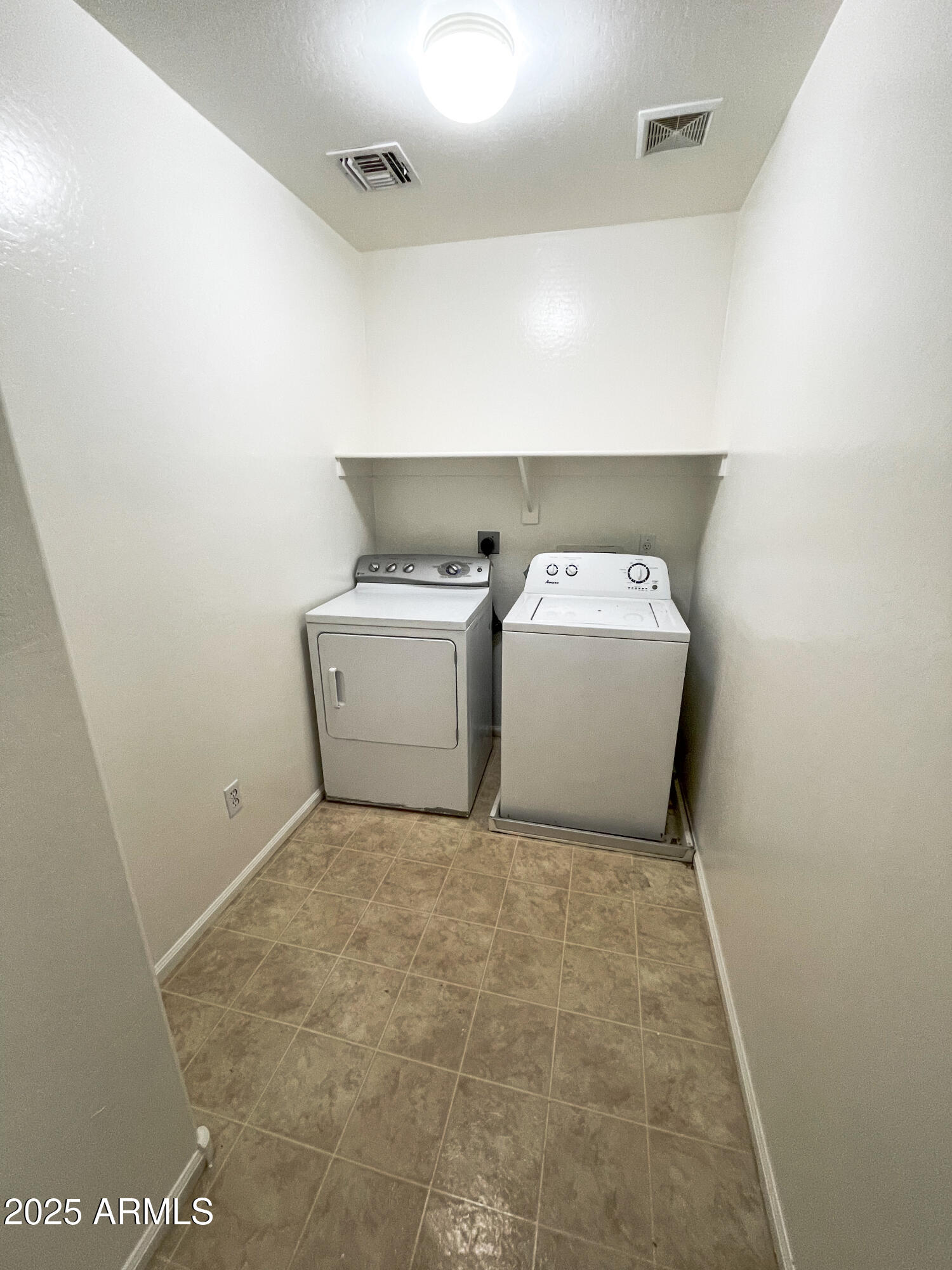 41389 Hopper Drive Maricopa, AZ 85138 - Photo 17 of 17 a utility room with a washer and dryer