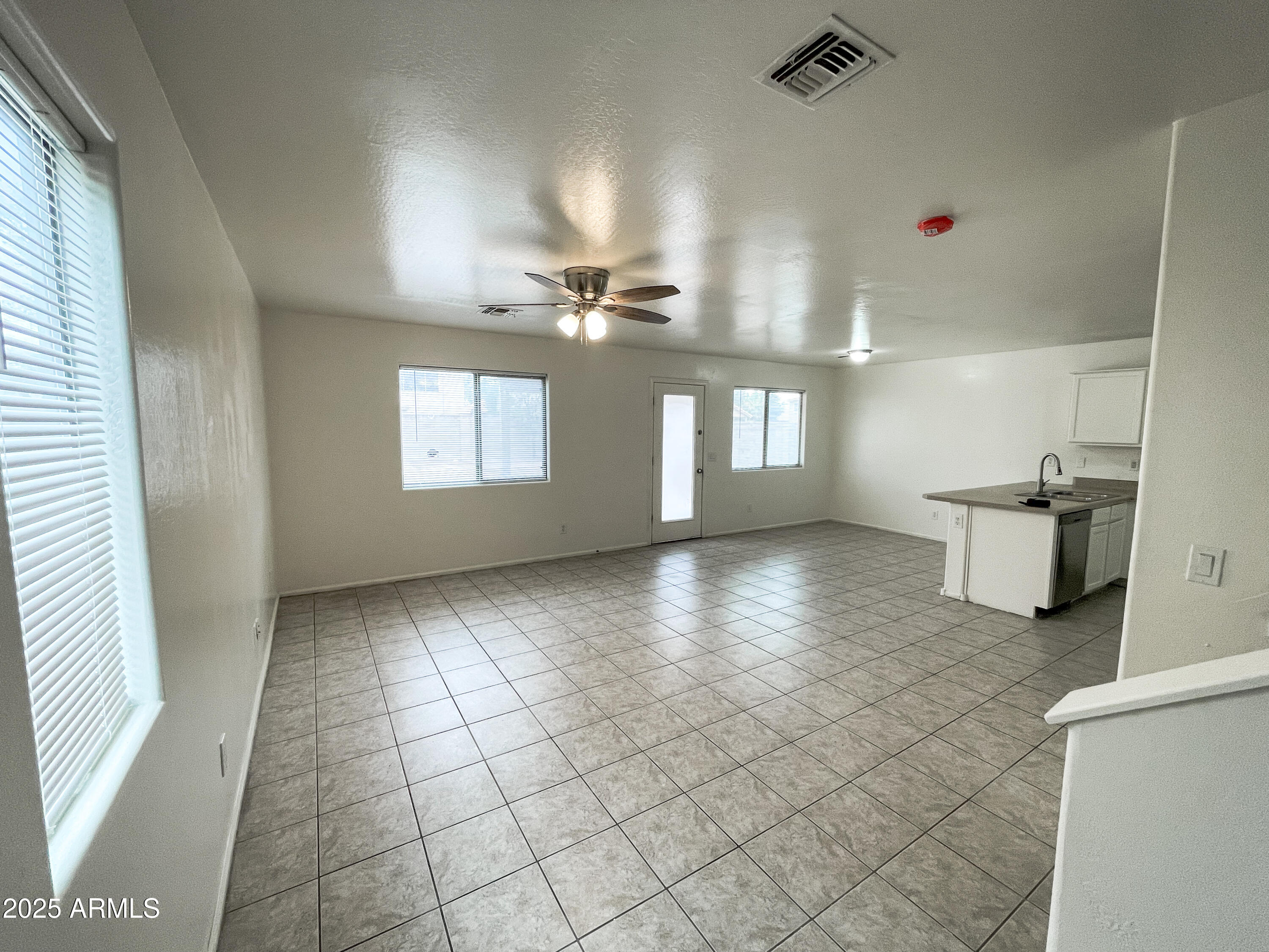 41389 Hopper Drive Maricopa, AZ 85138 - Photo 4 of 17 a view of an empty room and window