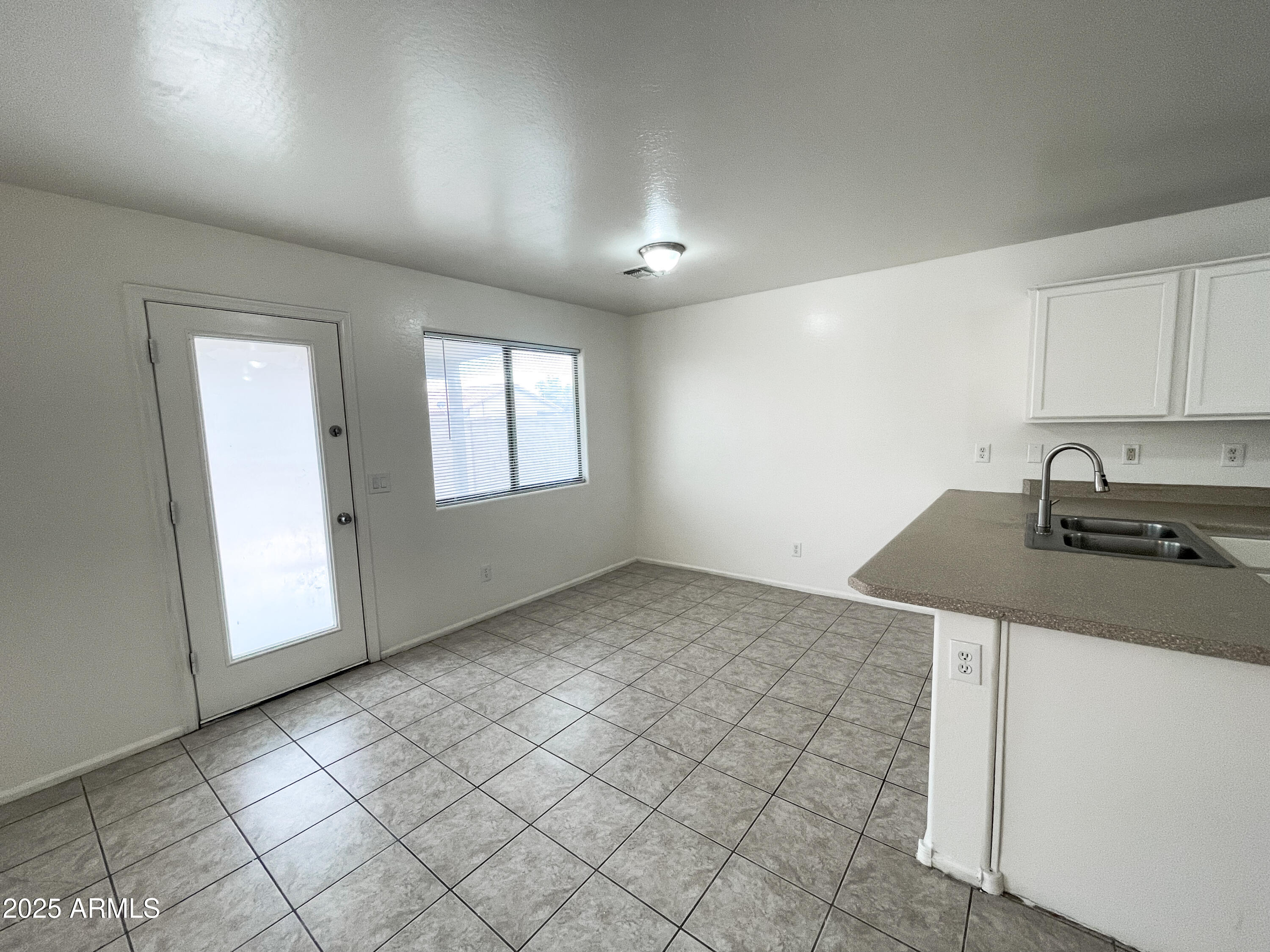 41389 Hopper Drive Maricopa, AZ 85138 - Photo 5 of 17 an empty room with windows